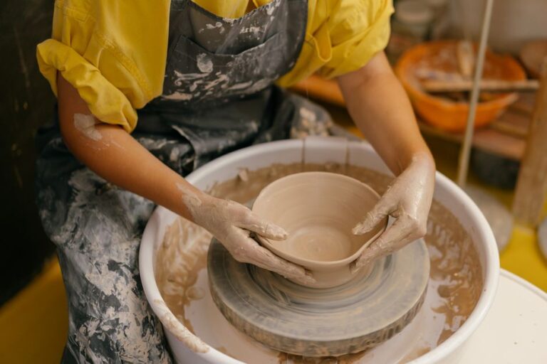 hands mending ceramic bowl